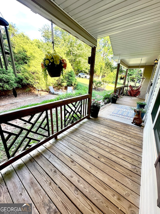 wooden terrace with covered porch