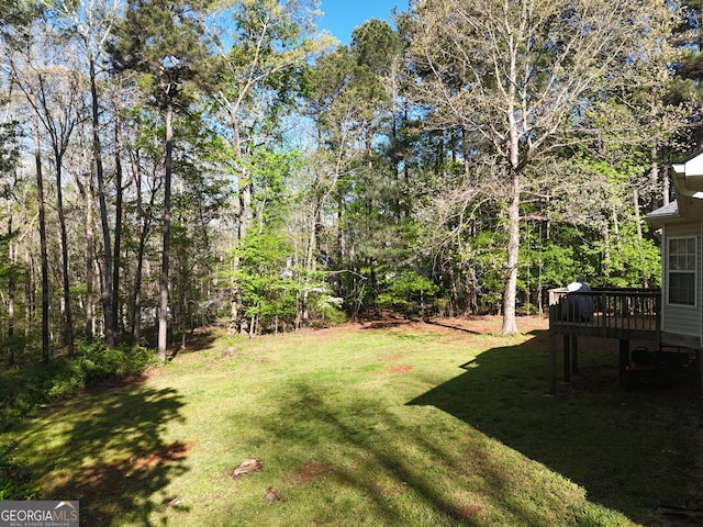 view of yard featuring a wooden deck