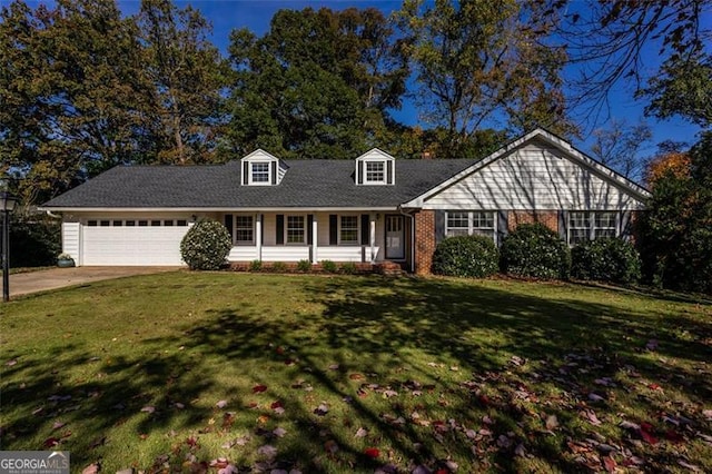 view of front of home with a garage and a front lawn