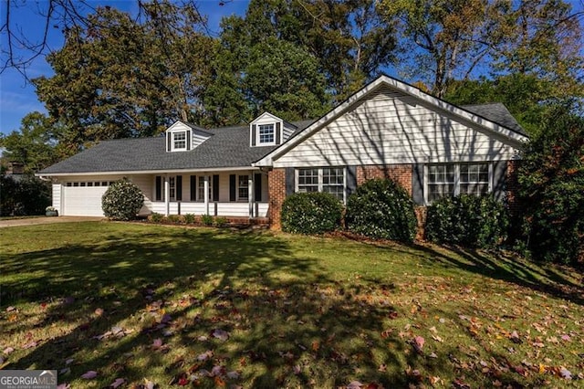 view of front of house featuring a front yard and a garage