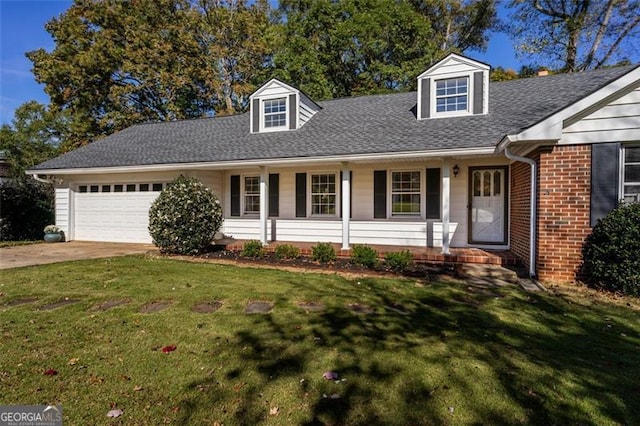 cape cod-style house featuring a porch, a garage, and a front yard