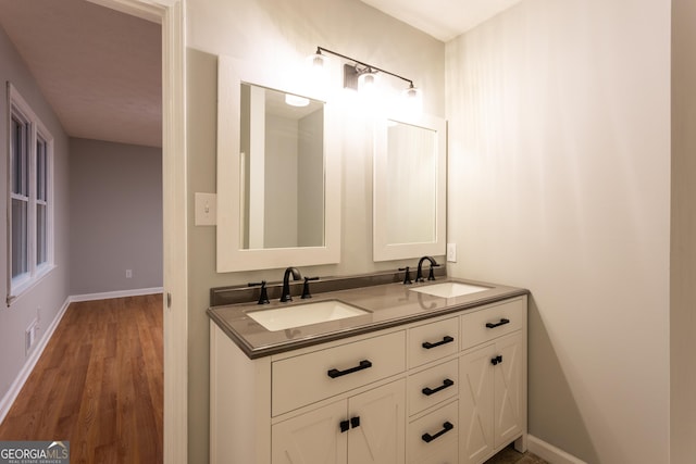 bathroom featuring vanity and hardwood / wood-style flooring