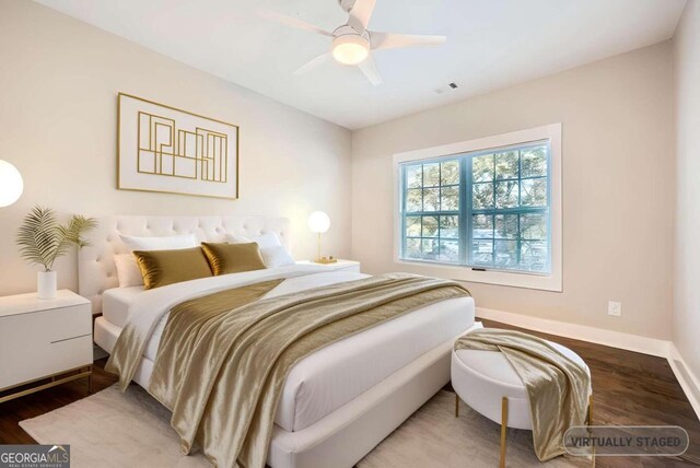 bedroom with ceiling fan and wood-type flooring