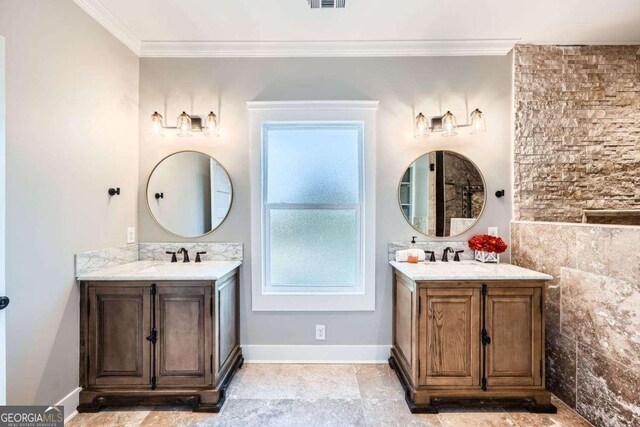 bathroom featuring crown molding, vanity, and tile walls