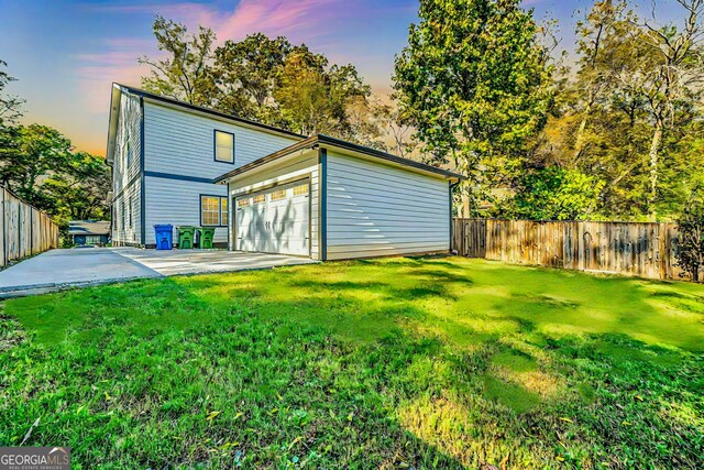 rear view of house featuring a yard