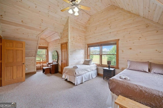 bedroom with carpet floors, ceiling fan, and wood walls