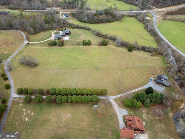 birds eye view of property featuring a rural view