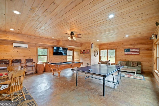 rec room featuring wooden ceiling, an AC wall unit, wooden walls, ceiling fan, and concrete flooring