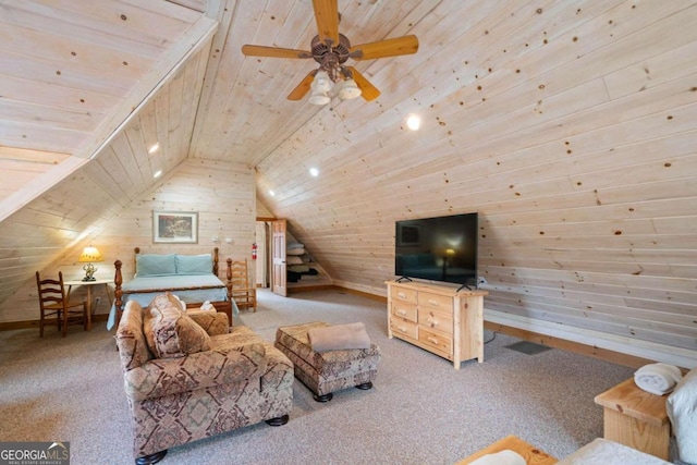 carpeted living room with lofted ceiling, ceiling fan, wooden ceiling, and wood walls