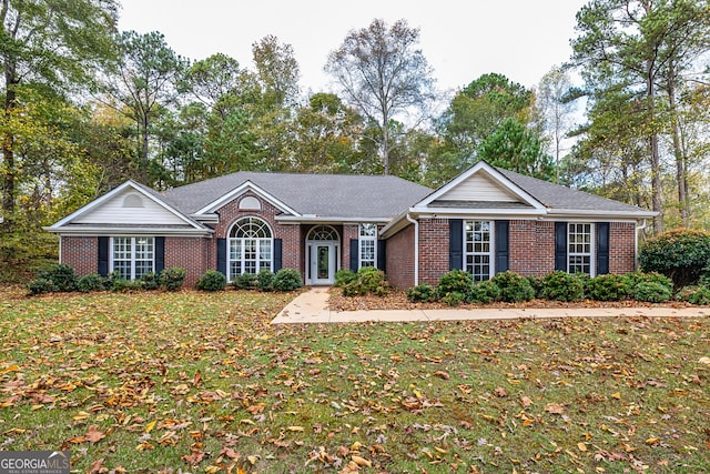 ranch-style home with a front yard