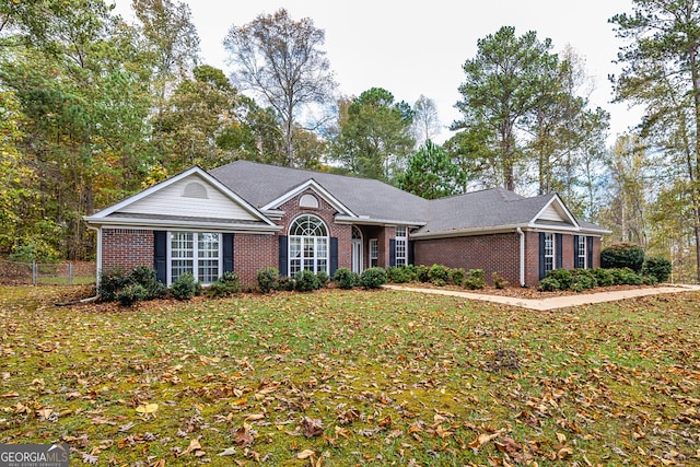 single story home with a front yard