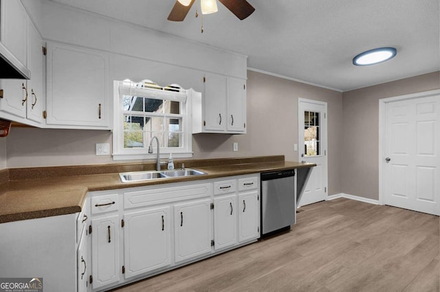 kitchen with white cabinetry, a wealth of natural light, and dishwasher