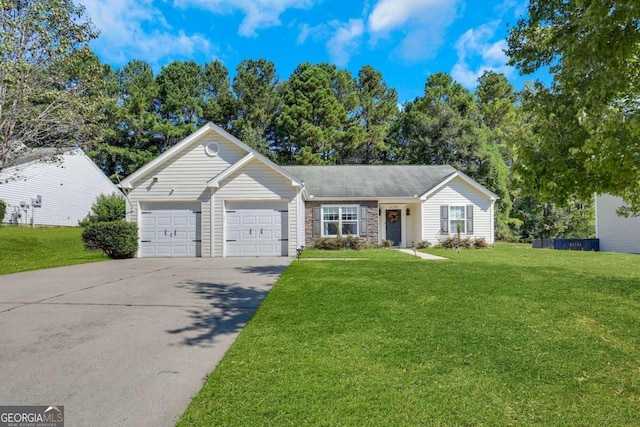 ranch-style home with a front yard and a garage