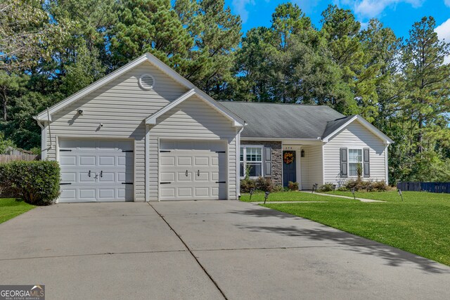 ranch-style house with a garage and a front lawn