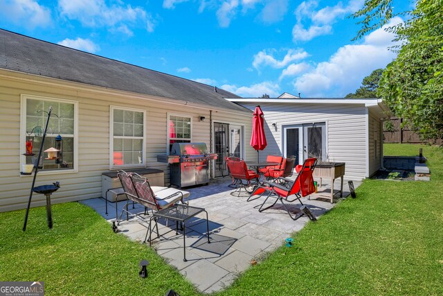 back of house featuring a patio and a lawn