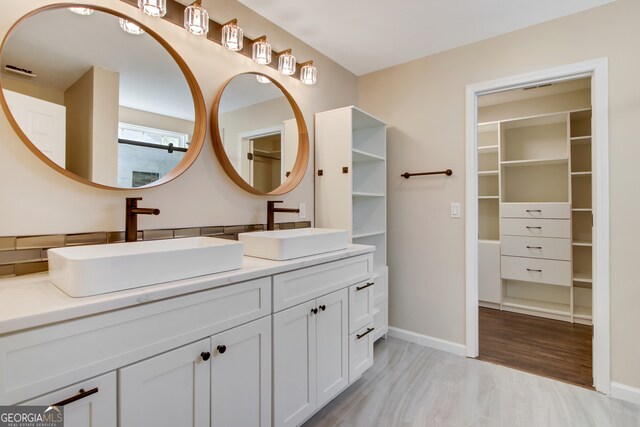 bathroom featuring hardwood / wood-style floors and vanity