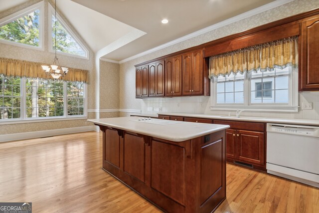 kitchen with vaulted ceiling, light hardwood / wood-style flooring, dishwasher, a chandelier, and a kitchen island