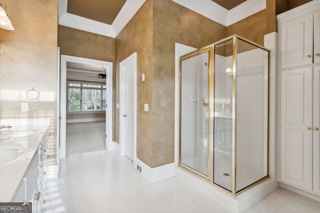 bathroom featuring tile patterned floors, vanity, an enclosed shower, and crown molding