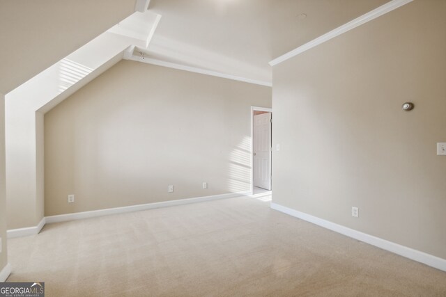 bonus room featuring light carpet and lofted ceiling with skylight