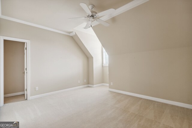 bonus room with light carpet, ceiling fan, and vaulted ceiling