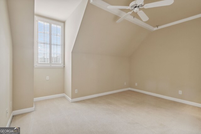 additional living space with ceiling fan, light carpet, and lofted ceiling