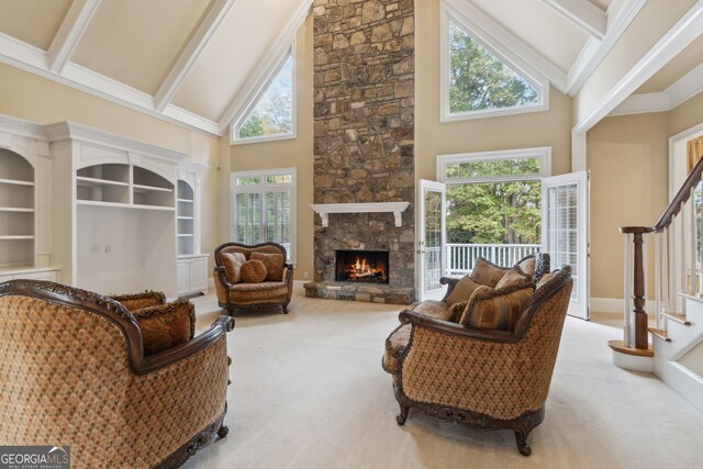 living room featuring carpet, a fireplace, high vaulted ceiling, and beam ceiling