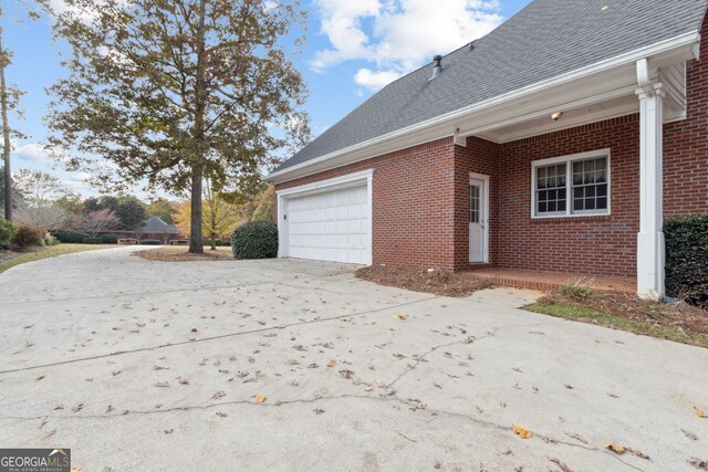 view of side of property with a garage