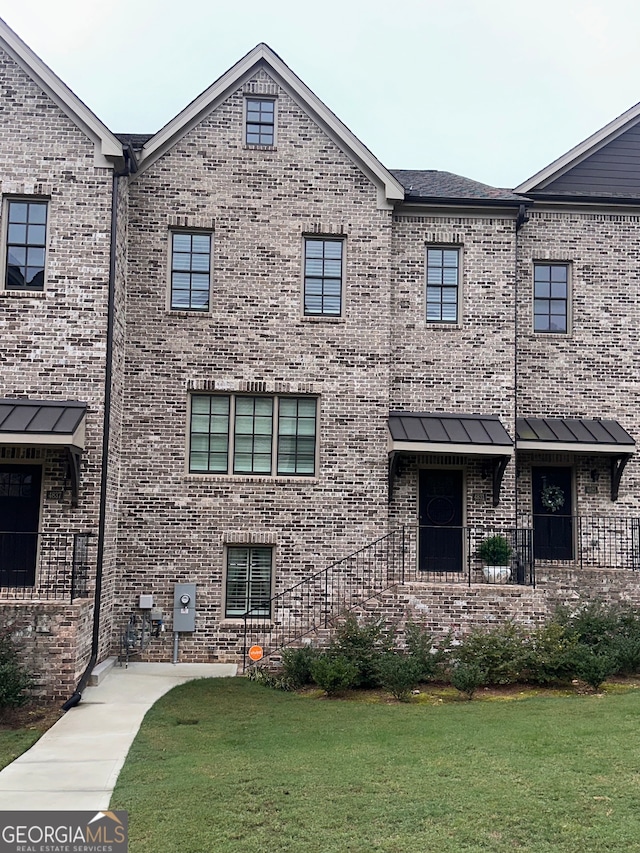 view of property with a front lawn