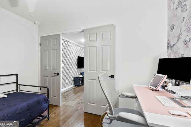 bedroom featuring hardwood / wood-style floors and ceiling fan