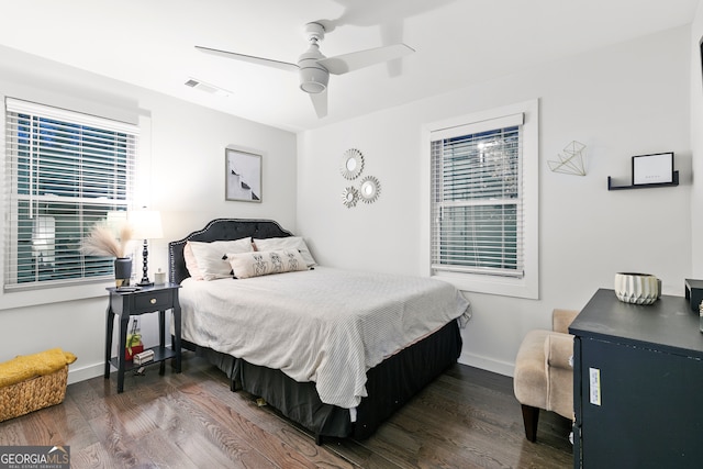 bedroom featuring dark hardwood / wood-style flooring and ceiling fan