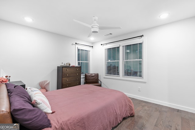 bedroom featuring ceiling fan and dark hardwood / wood-style flooring