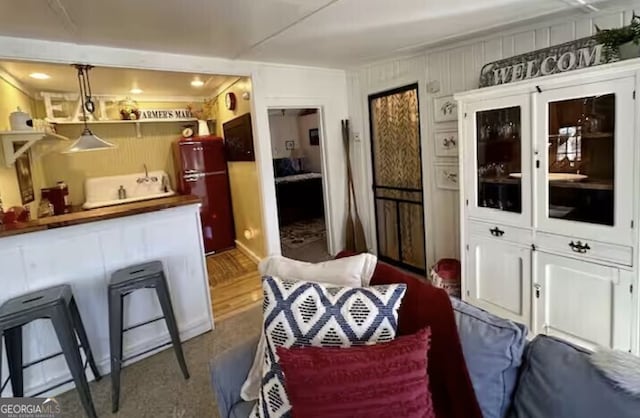 dining space featuring crown molding