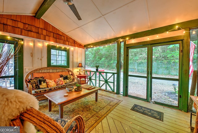 sunroom with lofted ceiling with beams