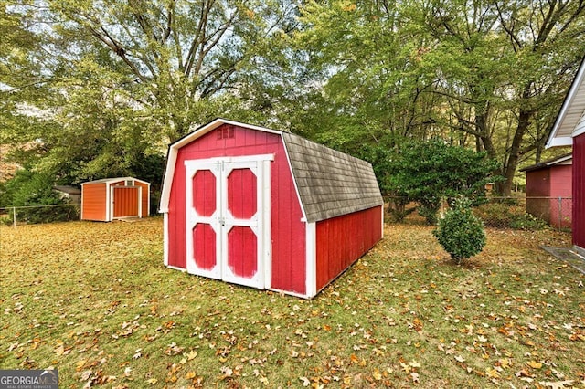 view of outbuilding featuring a lawn