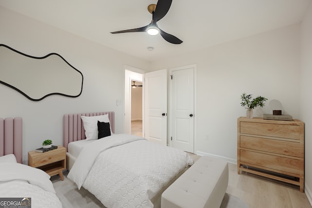 bedroom with ceiling fan and light hardwood / wood-style flooring