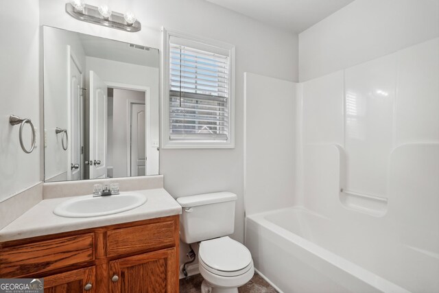 full bathroom featuring vanity, toilet, and bathing tub / shower combination