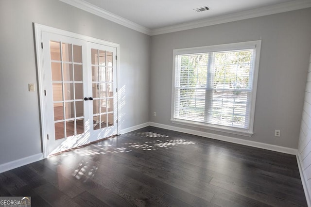 unfurnished room featuring plenty of natural light, ornamental molding, dark wood-type flooring, and french doors