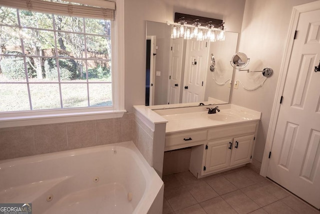 bathroom featuring tile patterned flooring, vanity, and a bathtub