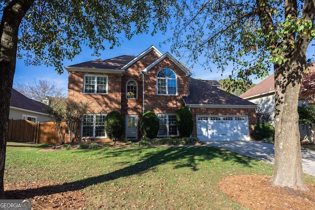 view of front of property featuring a garage and a front lawn