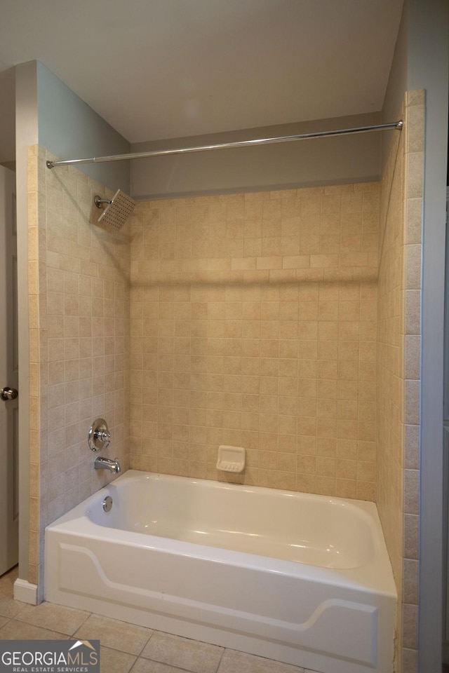 bathroom with tile patterned flooring and tiled shower / bath