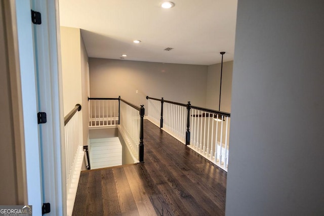 hall with dark hardwood / wood-style flooring