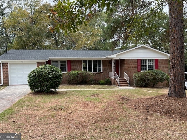 ranch-style house with a front yard and a garage