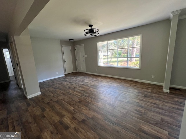 unfurnished dining area featuring dark hardwood / wood-style floors