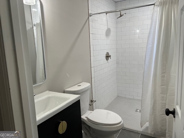 bathroom featuring a shower with curtain, tile patterned flooring, vanity, and toilet