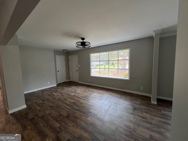 unfurnished living room with dark hardwood / wood-style flooring