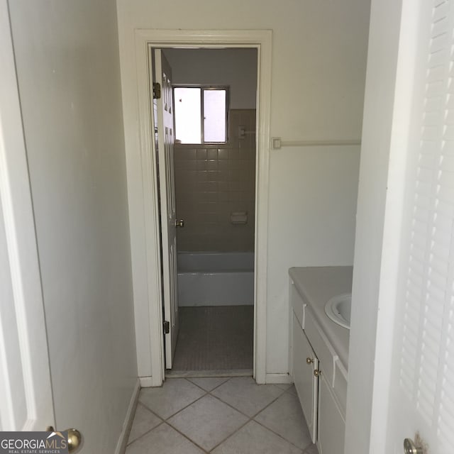 bathroom with tile patterned flooring and vanity