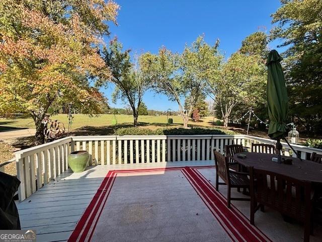 deck with outdoor dining space