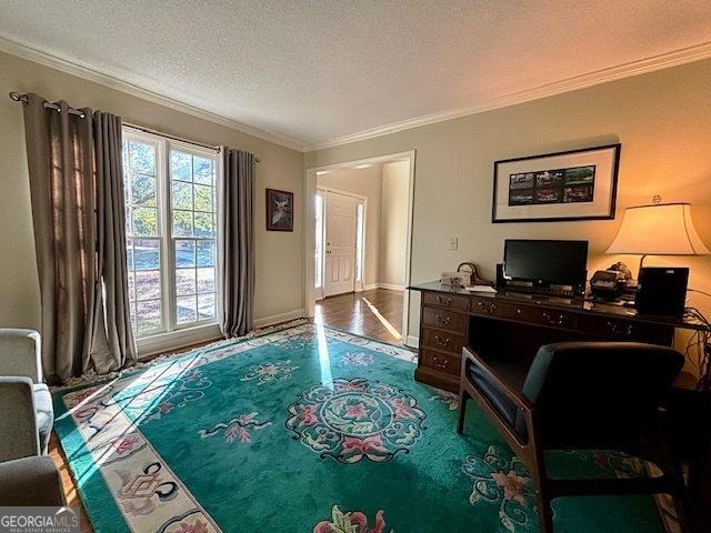 office area featuring ornamental molding and a textured ceiling