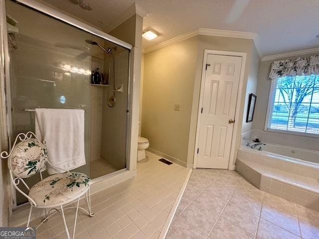 bathroom with visible vents, ornamental molding, a garden tub, tile patterned flooring, and a shower stall