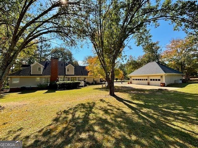 view of yard with a garage